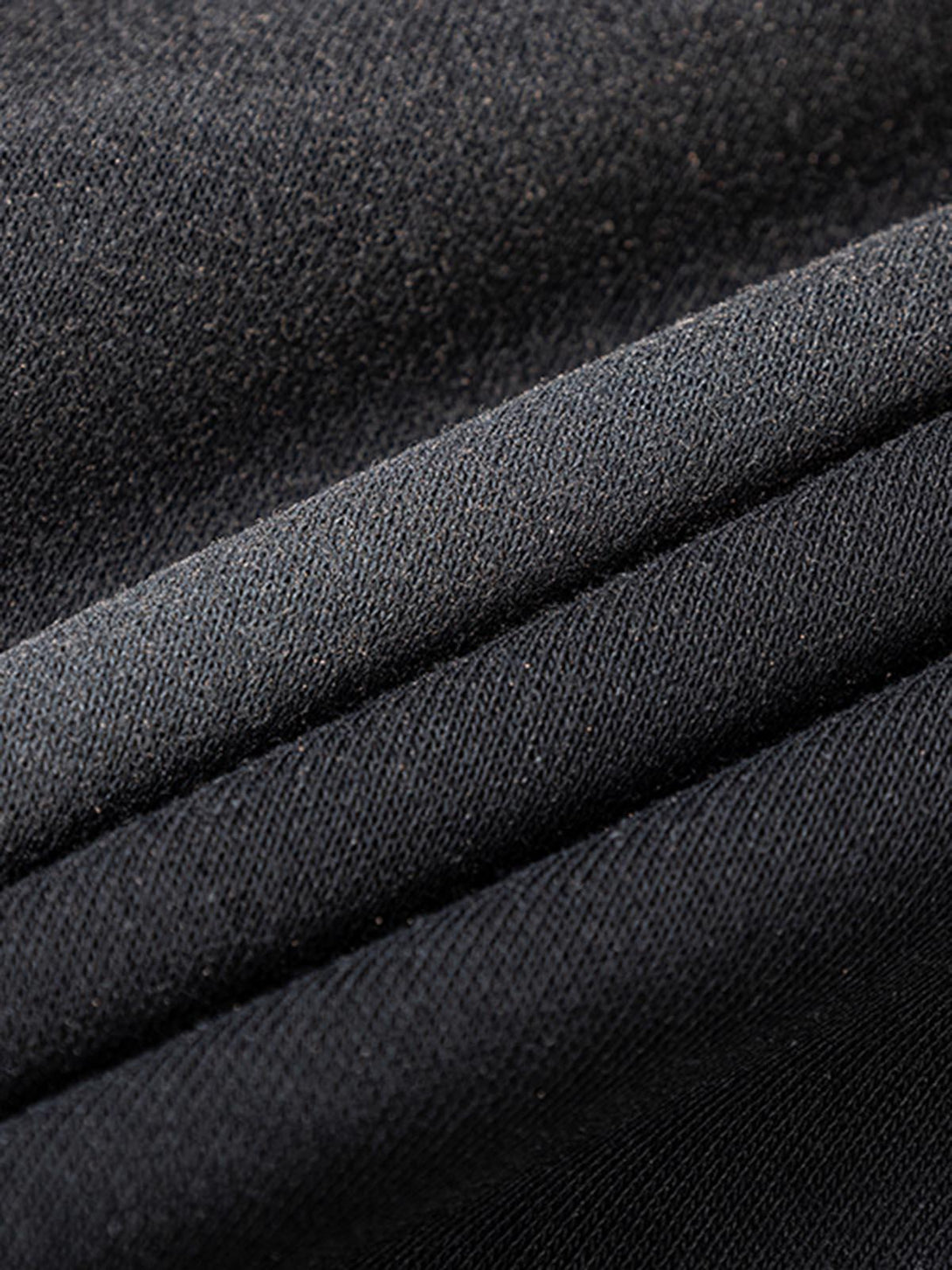 Zoomed-in texture of TALISHKO cross graphic hoodie fabric, highlighting its quality material.
