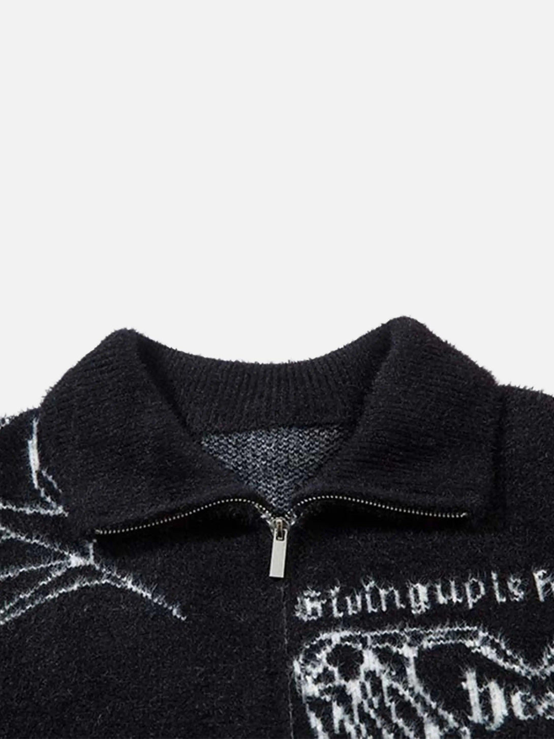 Focusing on the jacquard pattern and zipper detail of a TALISHKO cardigan with unique motifs.