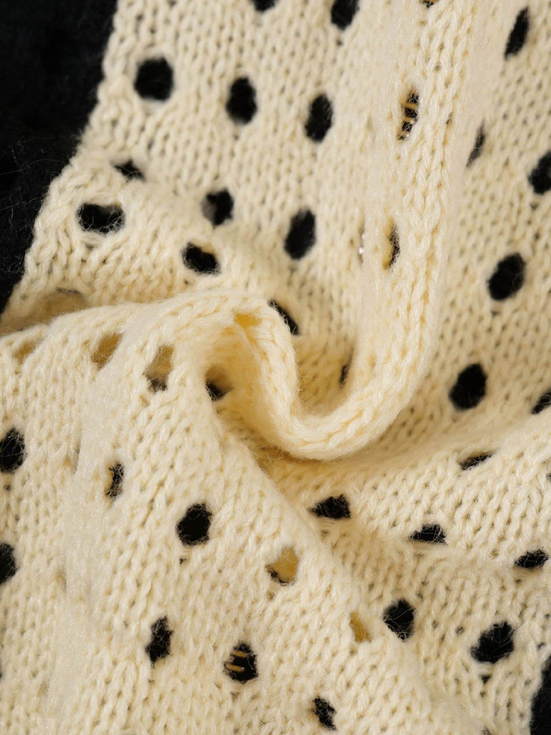 Intricate look at the TALISHKO jacket's cross jacquard pattern and texture detail.