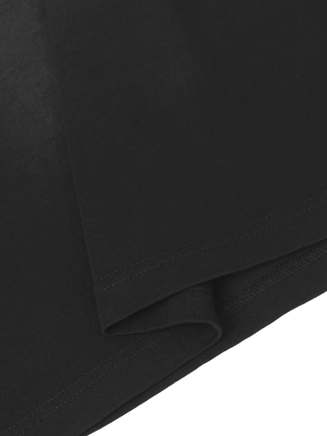 Zoomed-in texture of TALISHKO's black T-shirt sleeve, highlighting fine stitching details.