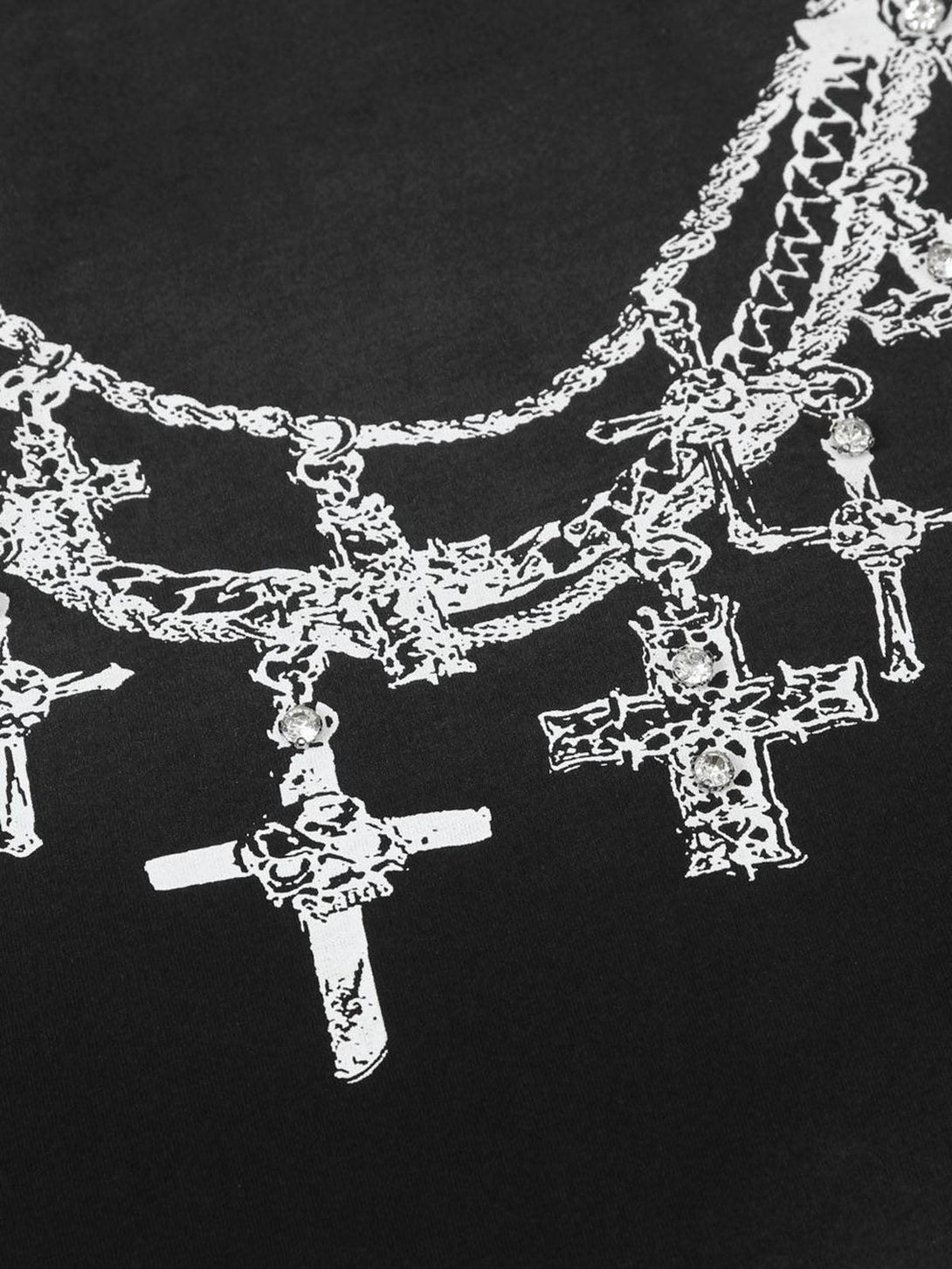 Intricate look at TALISHKO's graphic T-shirt, showcasing cross necklaces on black fabric.