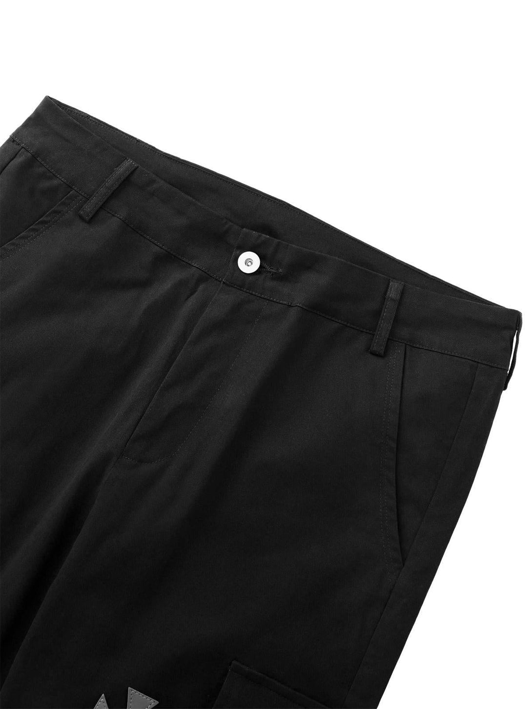 Zoomed-in detail of TALISHKO black casual pants showcasing the front pocket and button closure.