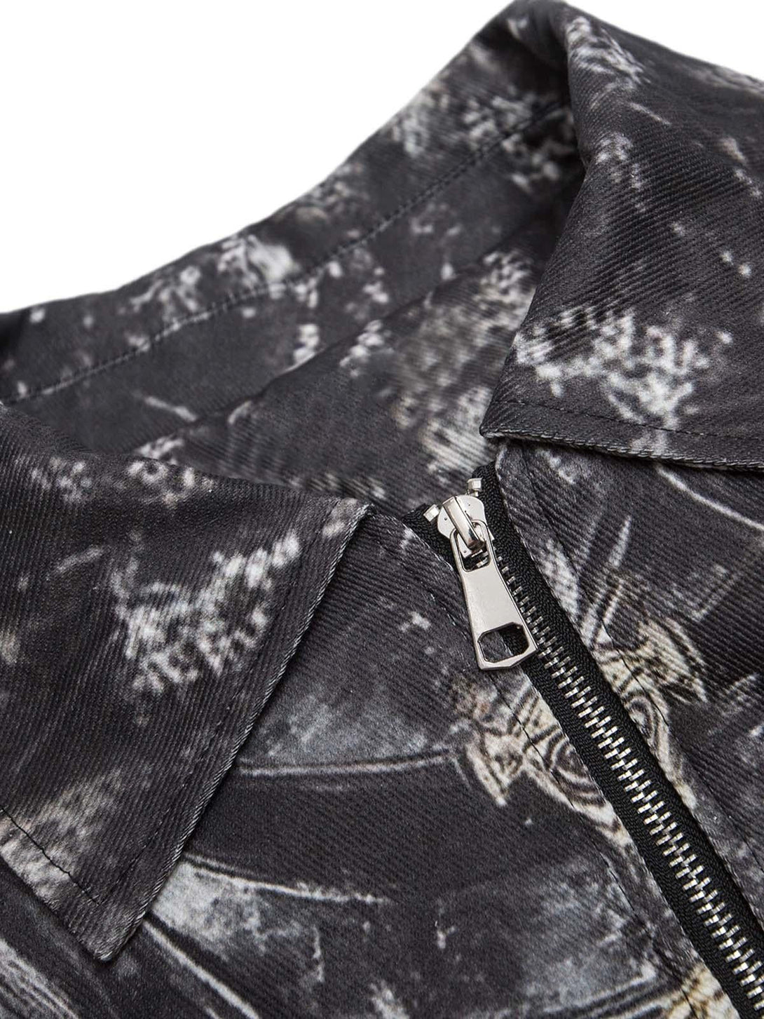 Intricate look at TALISHKO's zip-up bomber jacket, highlighting the cross print and collar.