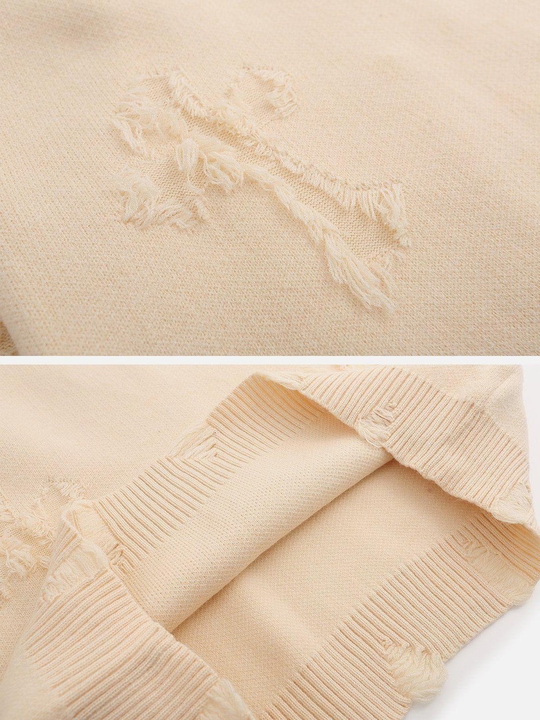 Intricate look at the frayed cross patchwork on a beige TALISHKO sweater, highlighting texture.