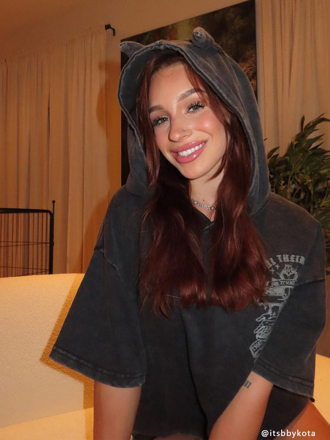 Casual washed hooded tee by TALISHKO, featuring a charming front print and playful ear details.