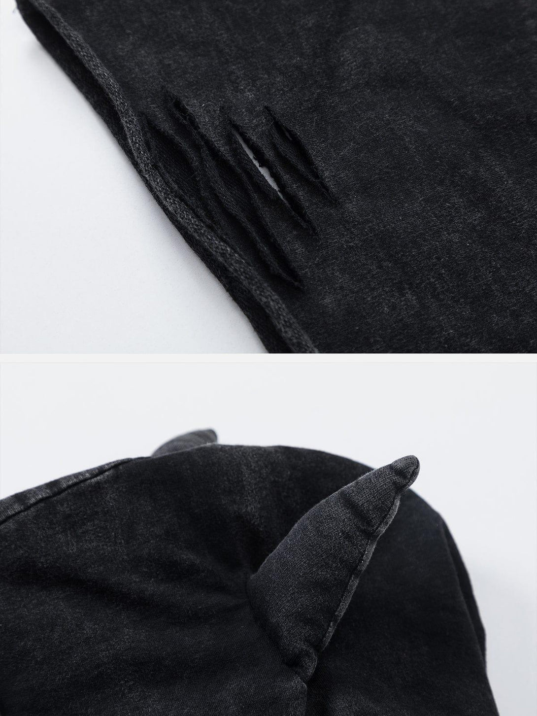 Focusing on the distressed details and playful ear design of a washed black tee by TALISHKO.