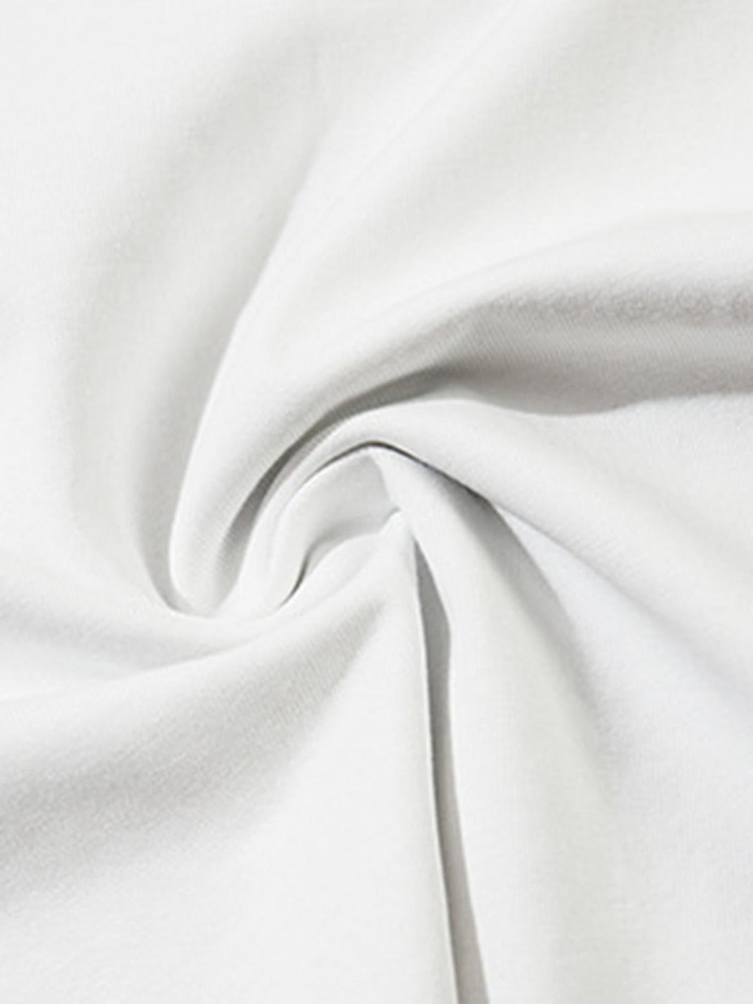 Zoomed-in texture of white TALISHKO hip-hop T-shirt fabric, highlighting its soft material.