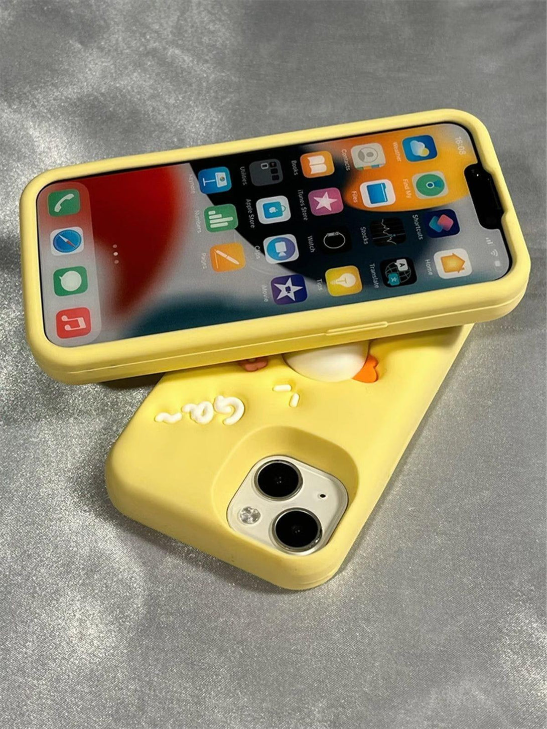 Yellow phone case with a playful 3D duck design by TALISHKO, adding a whimsical touch.