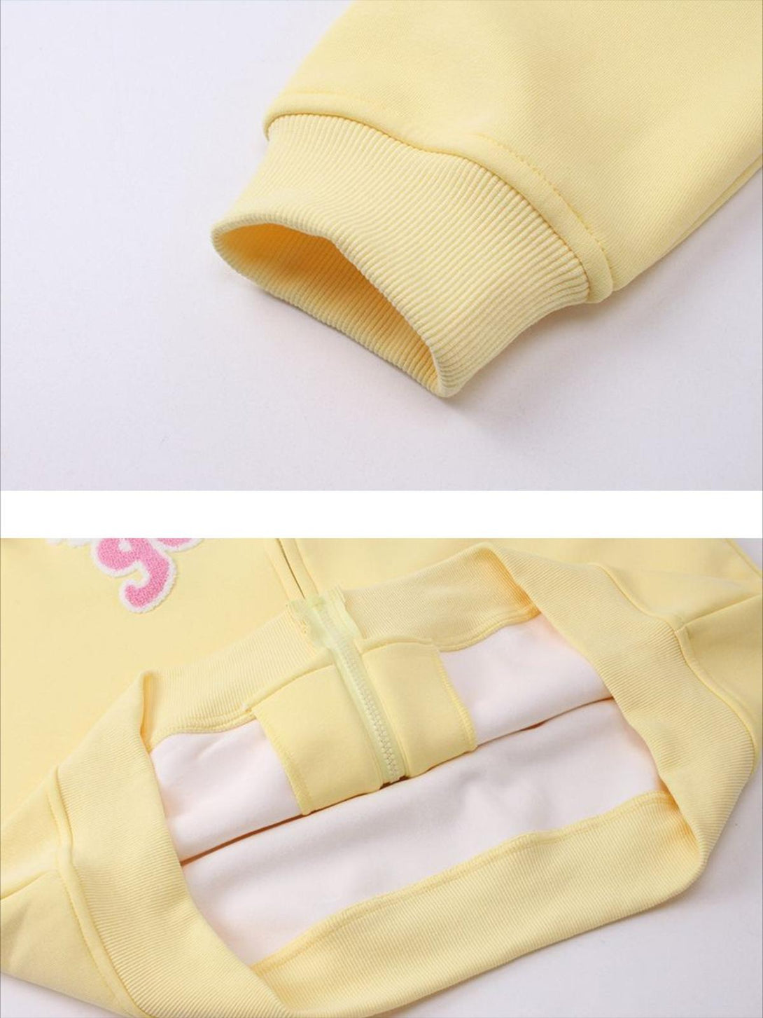 Detailed fabric and stitching of yellow zip-up hoodie by TALISHKO, showcasing ribbed cuffs.