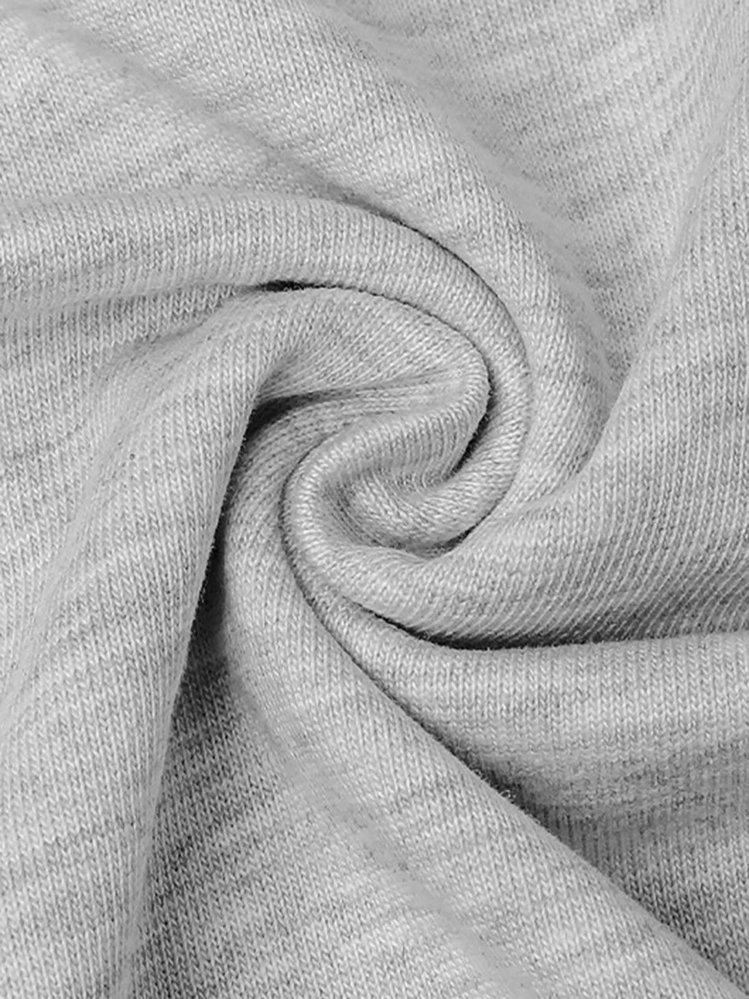 Zoomed-in texture of light gray fabric on a T-shirt by TALISHKO, highlighting material detail.