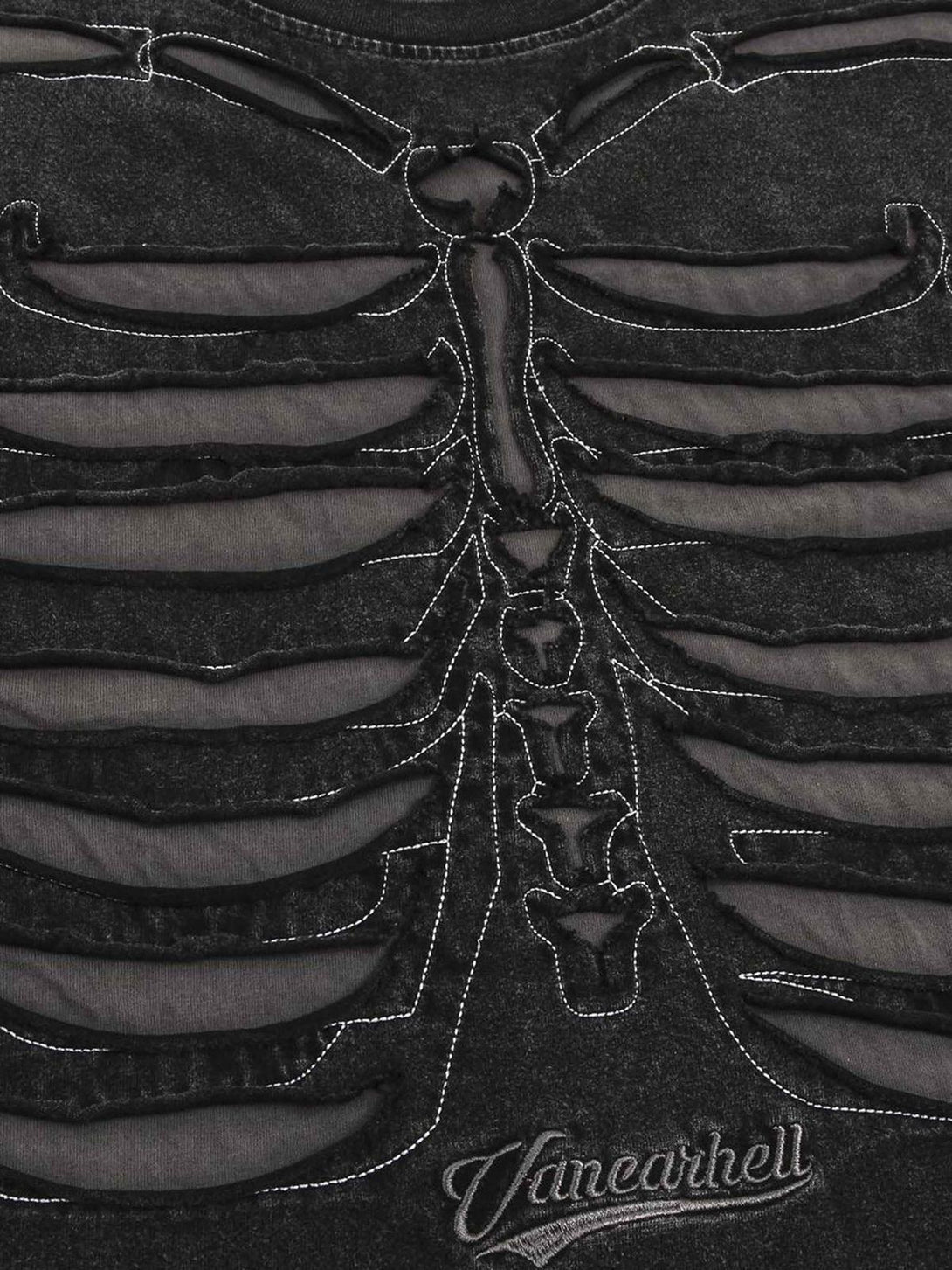 Intricate look at TALISHKO's dark washed T-shirt, highlighting the skeleton ribcage design.