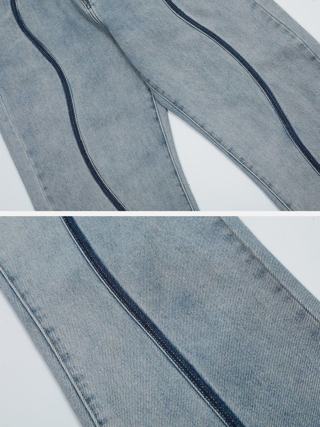 Zoomed-in texture of TALISHKO's curve patchwork jeans, highlighting unique denim details.