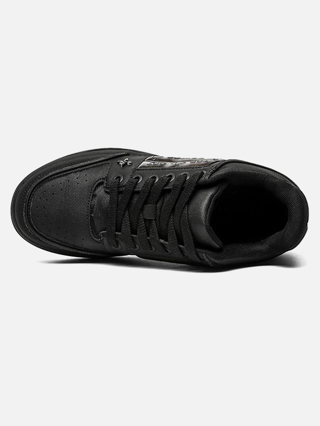 A top view of TALISHKO skate shoes, highlighting the dark embroidered details and sleek laces.