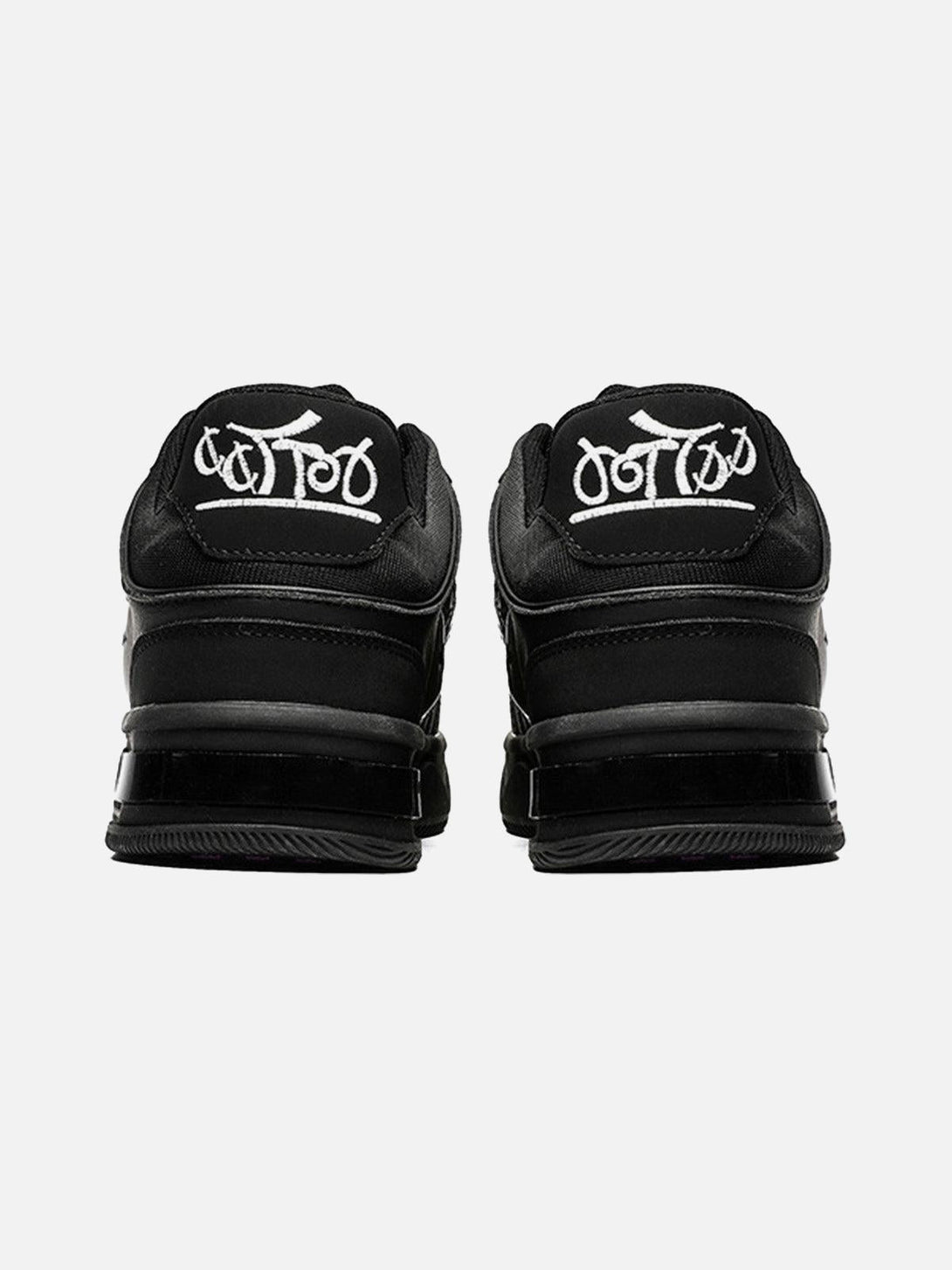 Back view of TALISHKO skate shoes, showcasing dark embroidered lettering on the heel.