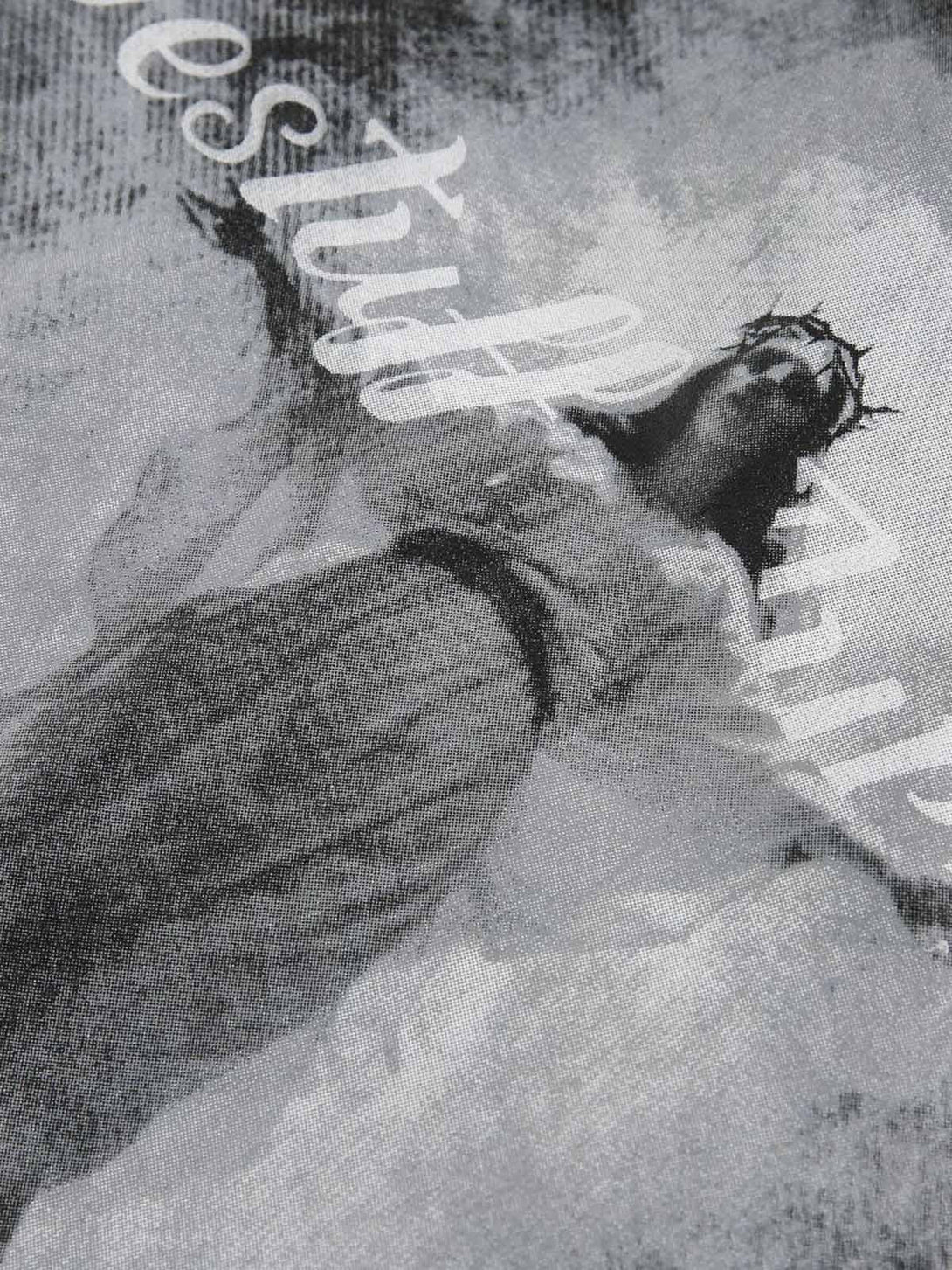 Intricate look at the artistic design on TALISHKO's dark graffiti suede jacket, highlighting unique style.