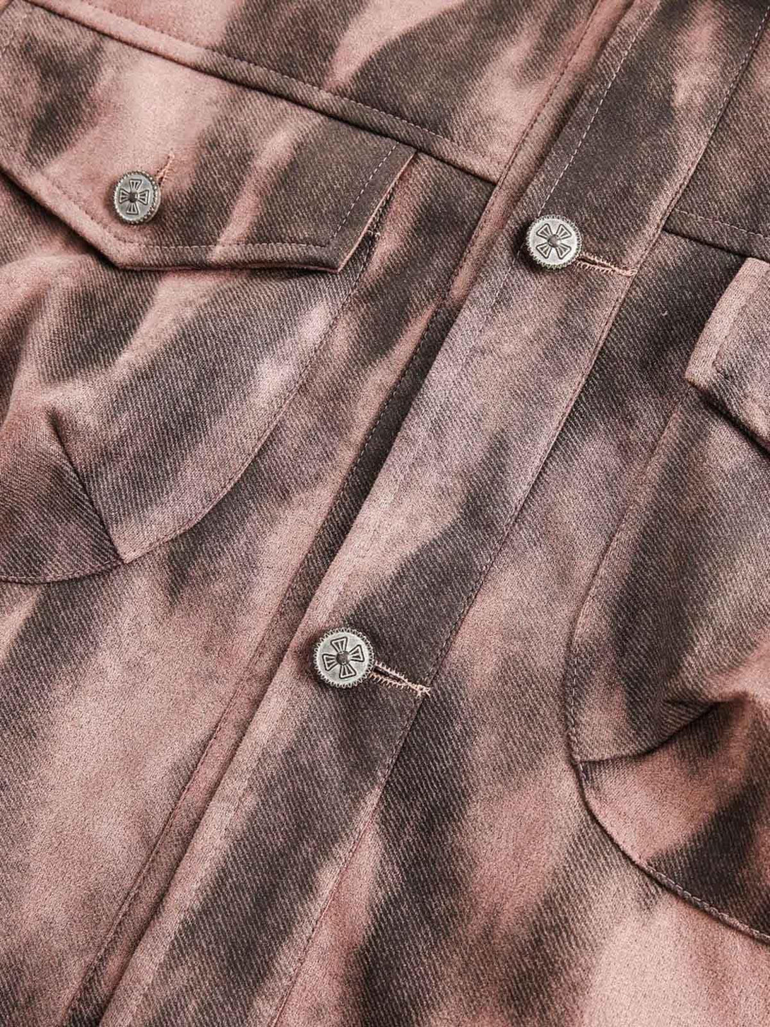 Detailed fabric and buttons on TALISHKO's dark graffiti suede utility jacket, highlighting craftsmanship.