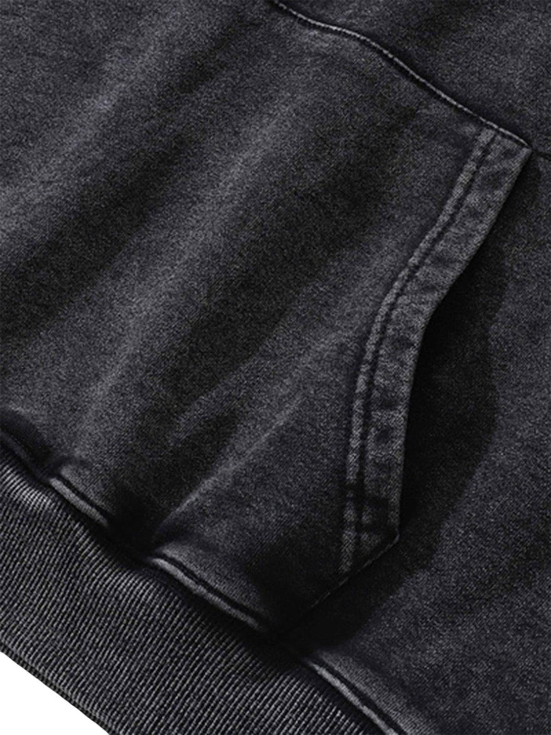 A close-up of the TALISHKO Doberman hoodie's pocket, highlighting its dark, textured fabric.