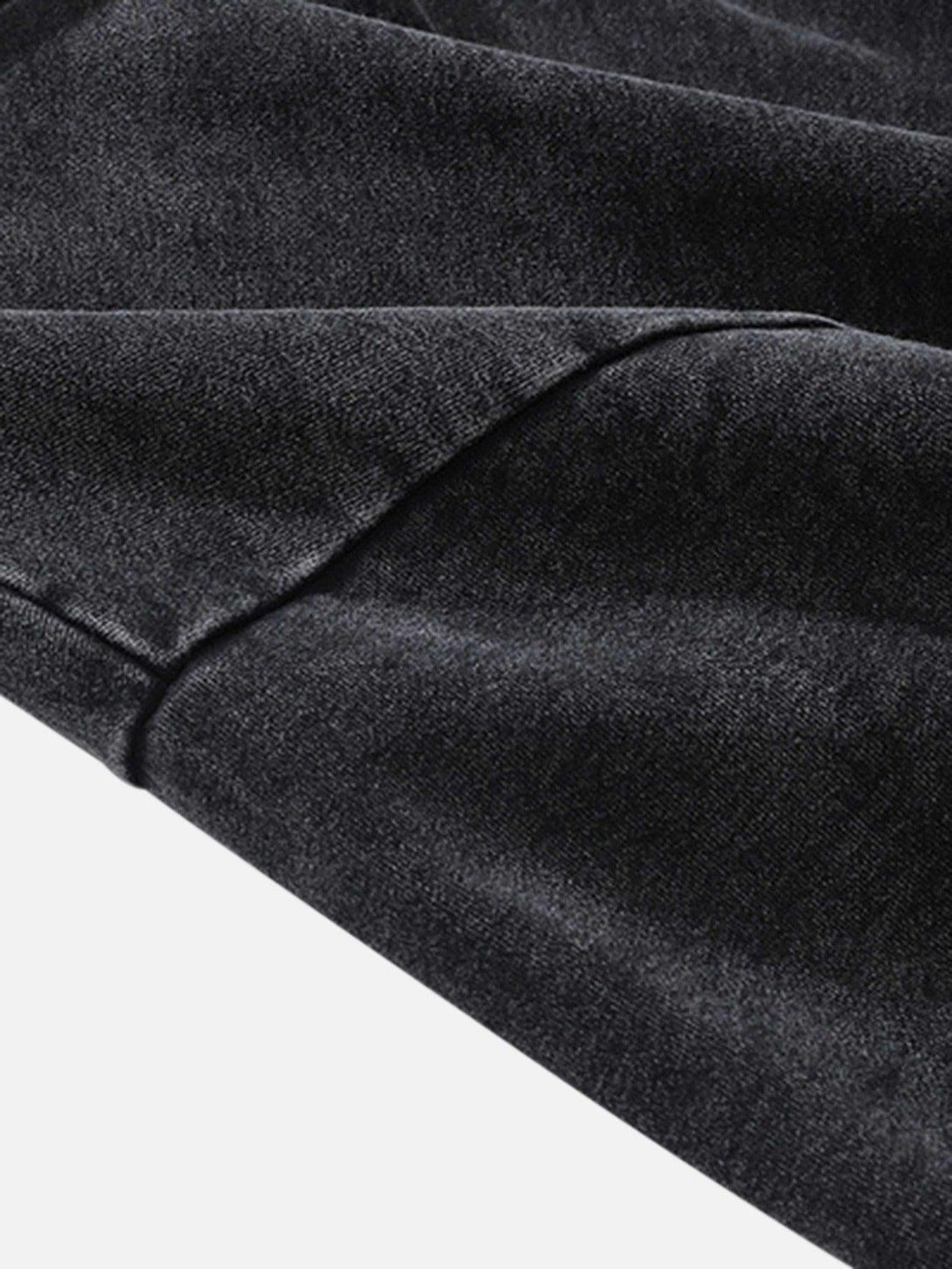 Zoomed-in texture of a dark TALISHKO hoodie, highlighting its soft and cozy fabric.