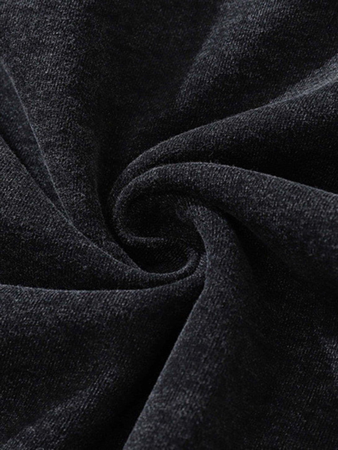 Textured view of soft, dark fabric from a TALISHKO hoodie, showcasing its cozy feel.