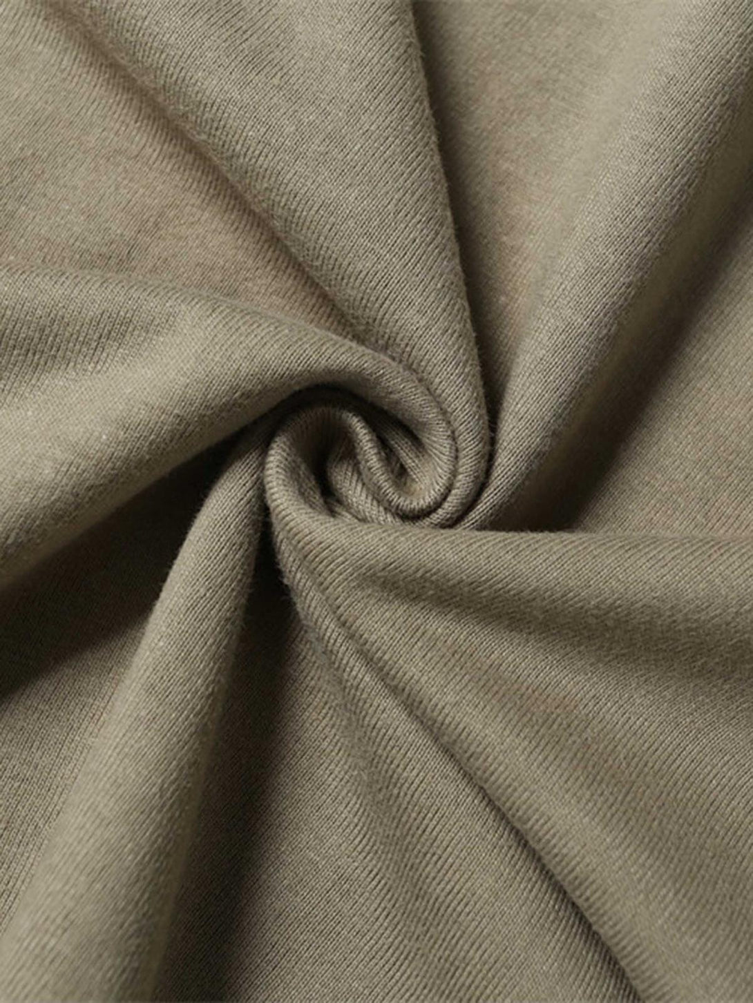 Intricate look at khaki T-shirt fabric texture by TALISHKO, highlighting quality material.