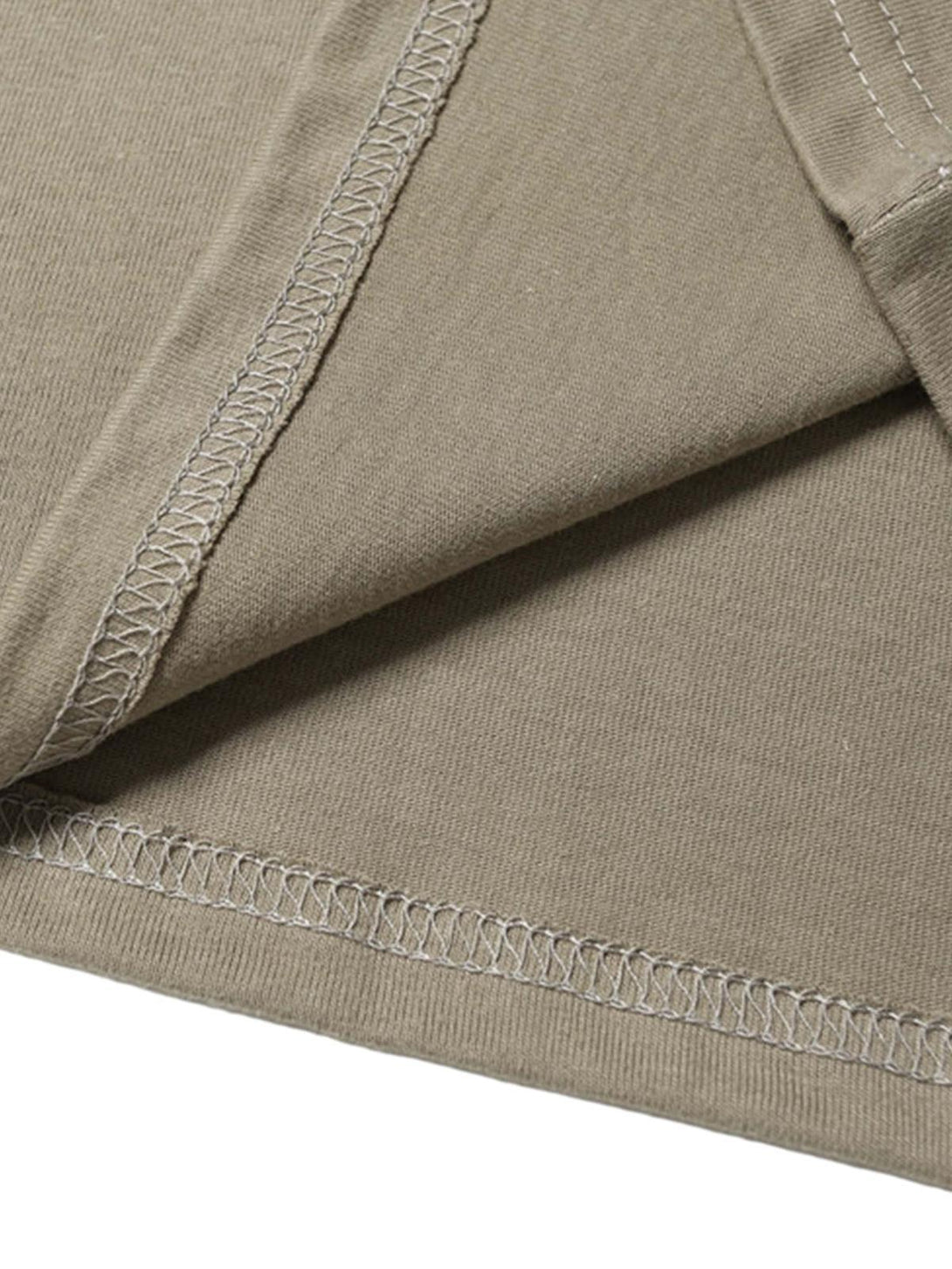 Detailed fabric and stitching of khaki T-shirt by TALISHKO, showcasing quality craftsmanship.