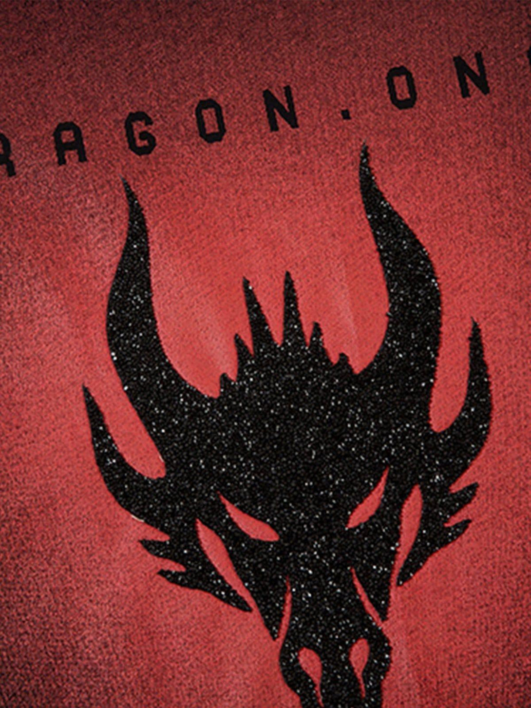 A detailed view of a black dragon design on a red tee by TALISHKO, highlighting bold texture.