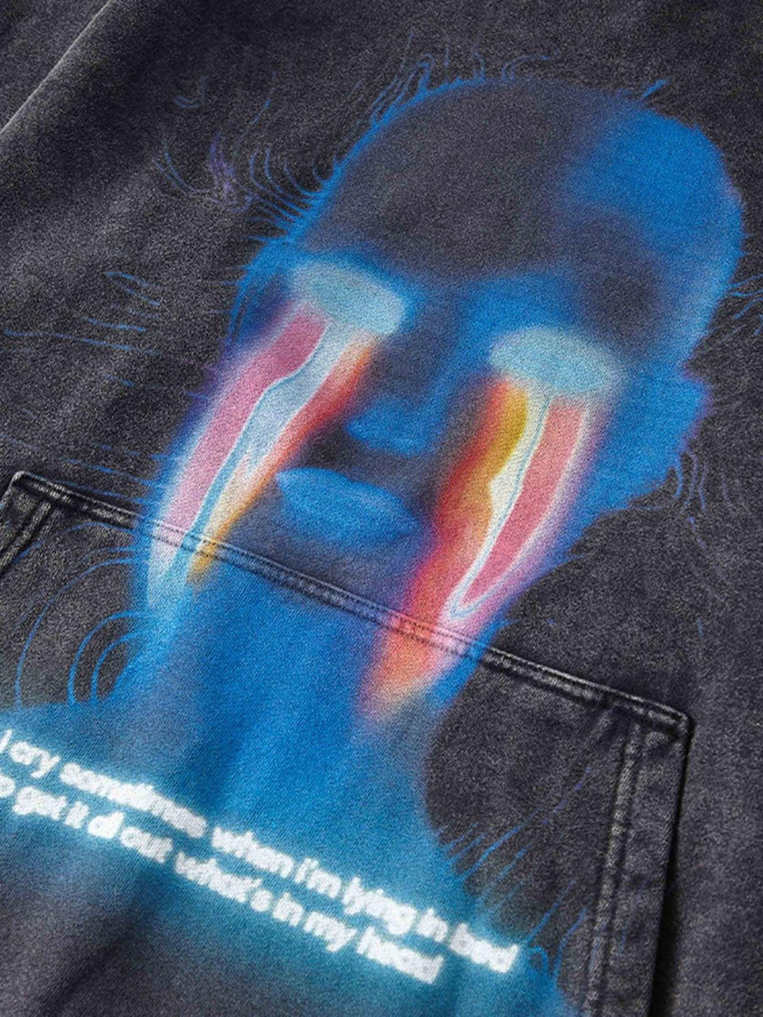 Intricate look at TALISHKO's dark sweatshirt, highlighting the artistic graphic and unique design.