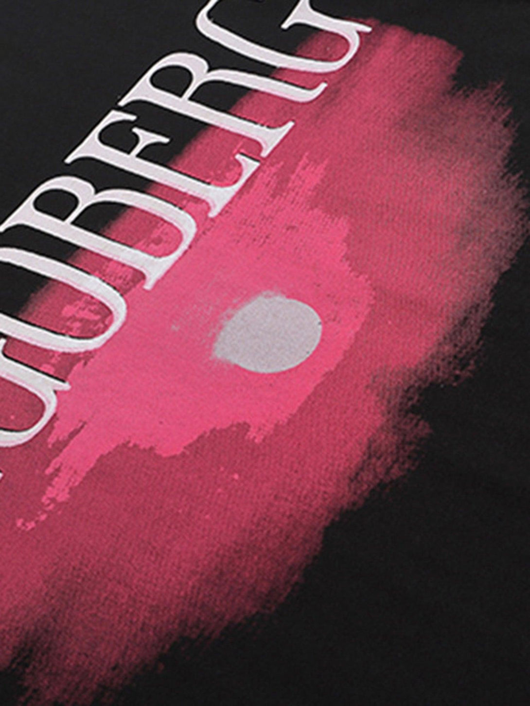 A tight crop highlighting the bold pink sunset design on a TALISHKO street rap T-shirt.