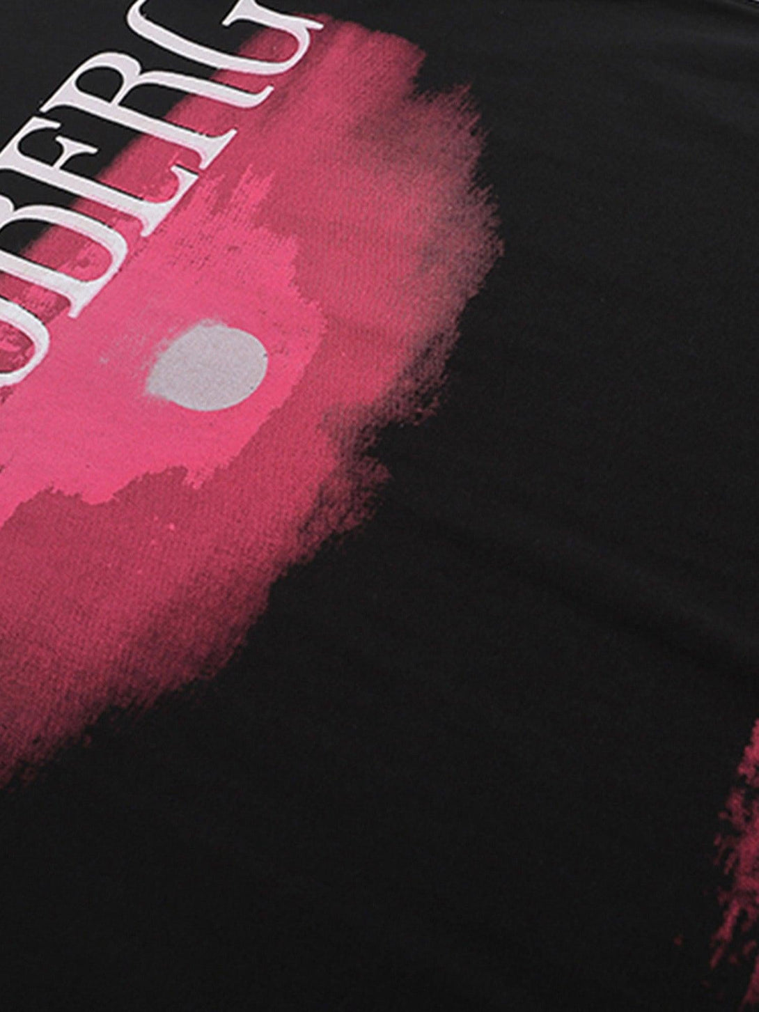 Intricate look at the pink sunset print on a TALISHKO T-shirt, highlighting its artistic flair.