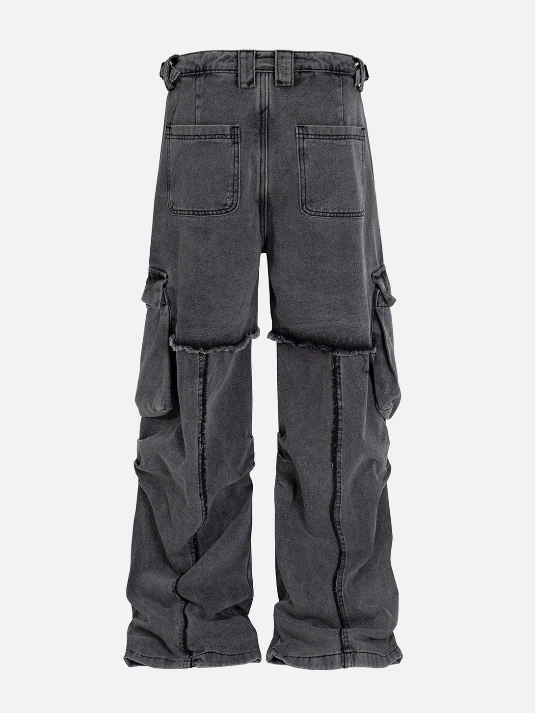 Back view of TALISHKO's deconstructed fringe jeans with large pockets, showcasing their unique style.