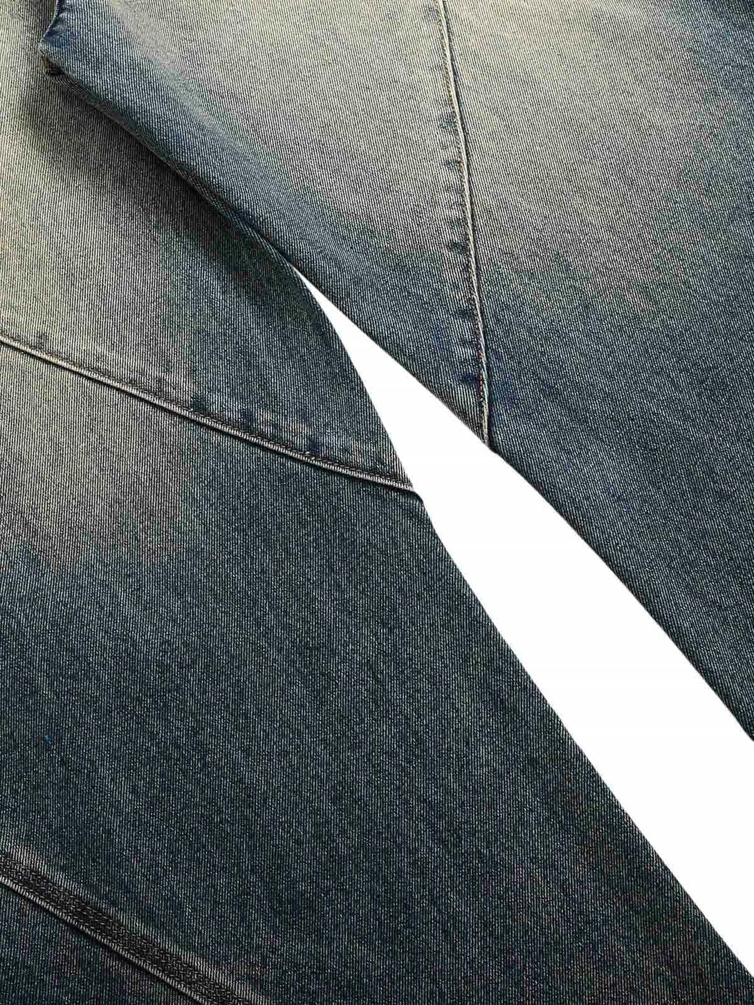 Intricate look at TALISHKO's deconstructed straight jeans, showcasing unique seam details.