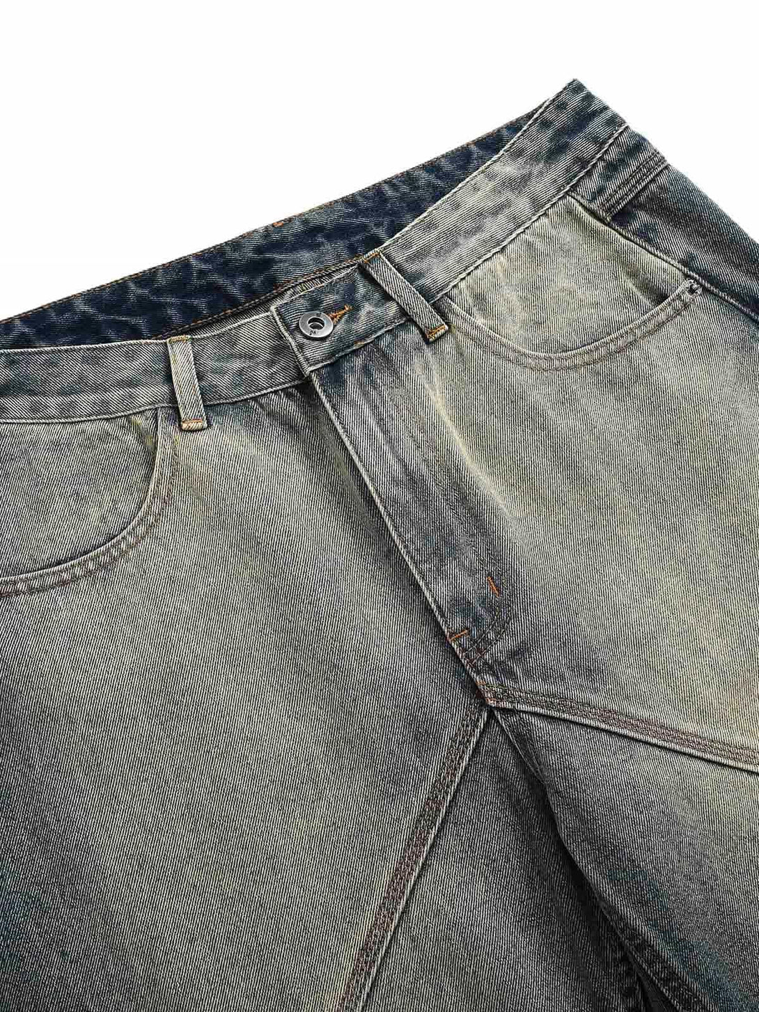 Focusing on TALISHKO's deconstructed straight jeans, highlighting unique seam and fabric details.