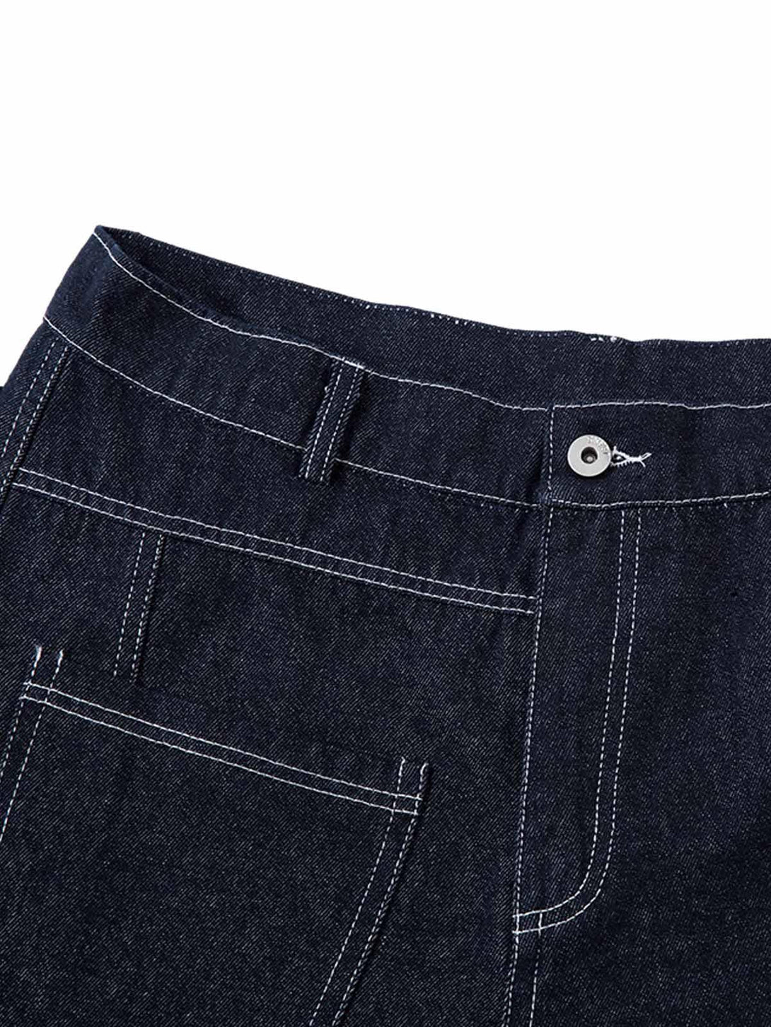 A detailed view of the deconstructed stitching on TALISHKO barrel jeans, highlighting texture.