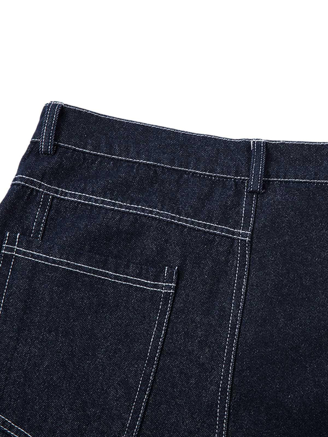 Detailed fabric and stitching on TALISHKO barrel jeans, highlighting contrast and texture.