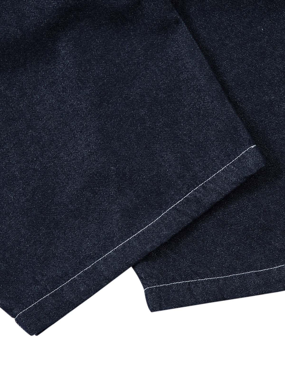 Detailed fabric and stitching of TALISHKO jeans, highlighting the contrast stitch design.