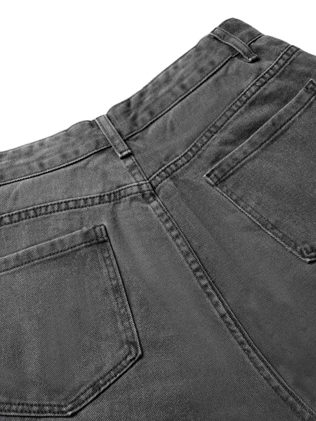 Focusing on the back of TALISHKO deconstructed cargo jeans, showcasing pocket details.
