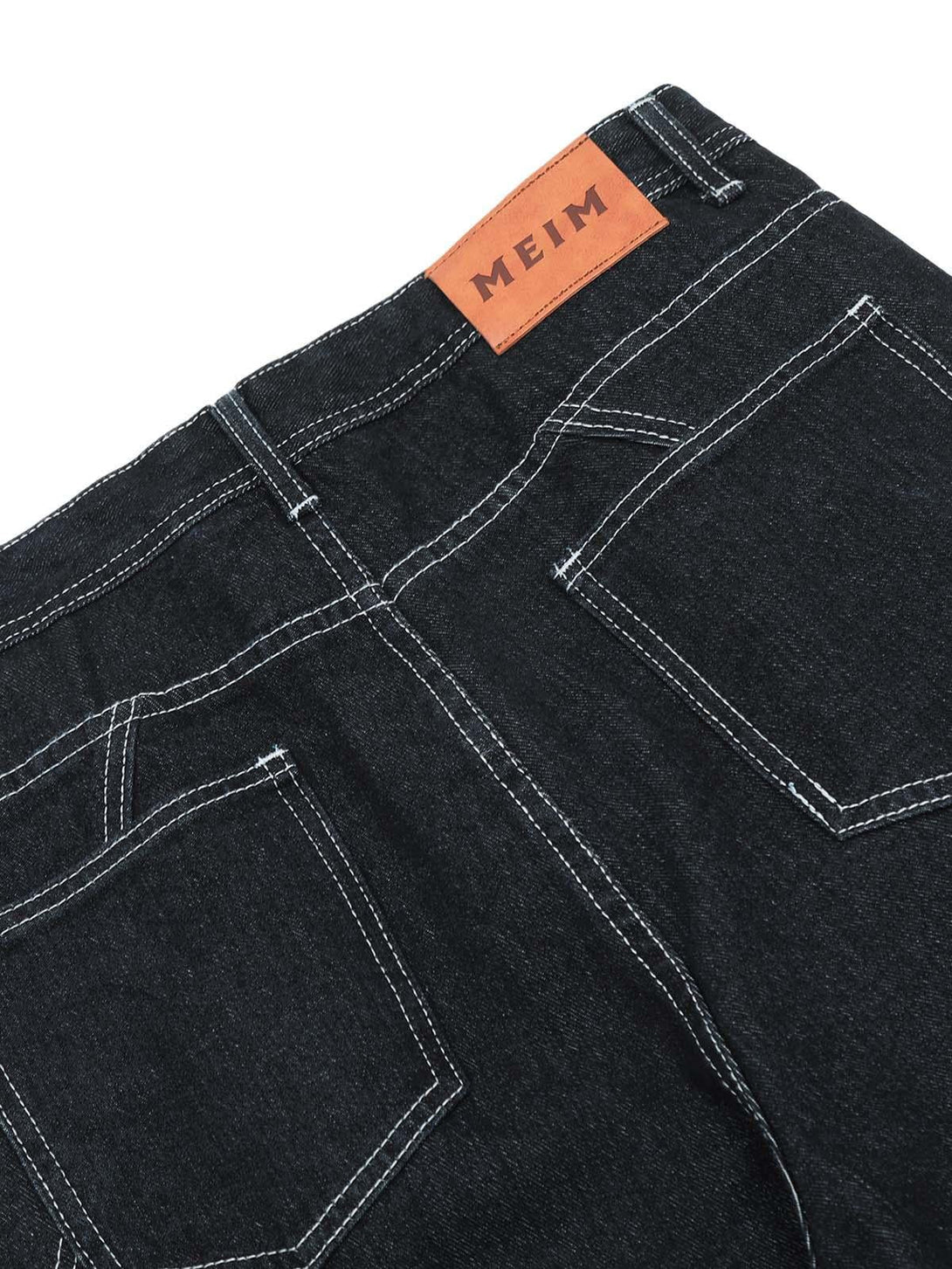 Back detail of TALISHKO cargo jeans, highlighting pockets and stitching for versatile styling.