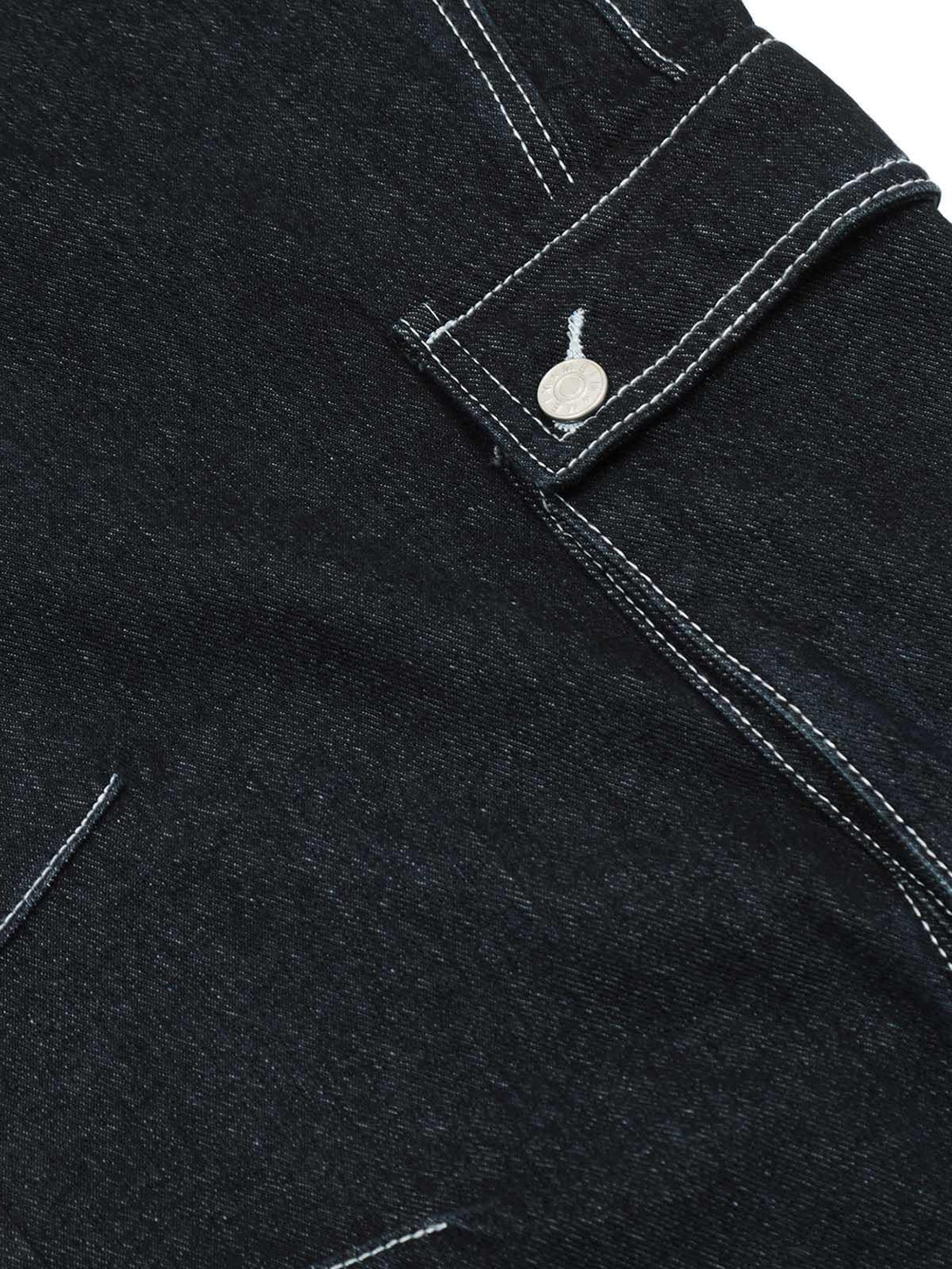 Intricate stitching and pocket detail on TALISHKO cargo jeans, highlighting craftsmanship.