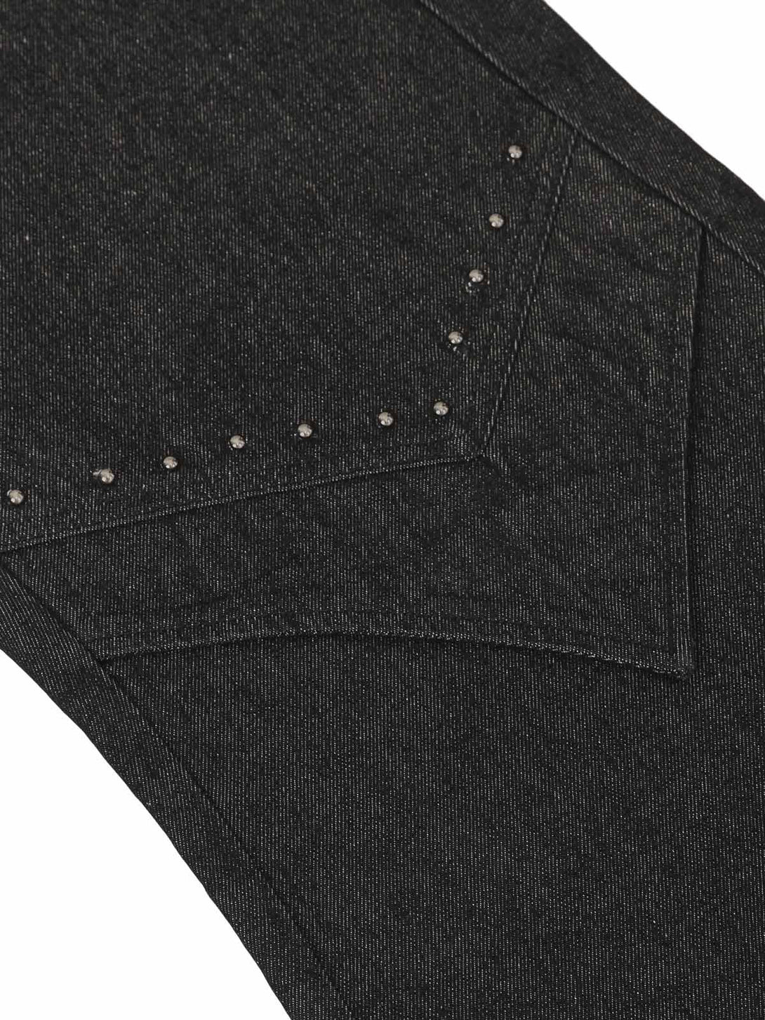 Intricate look at TALISHKO jeans highlighting rivet details and unique pocket design.