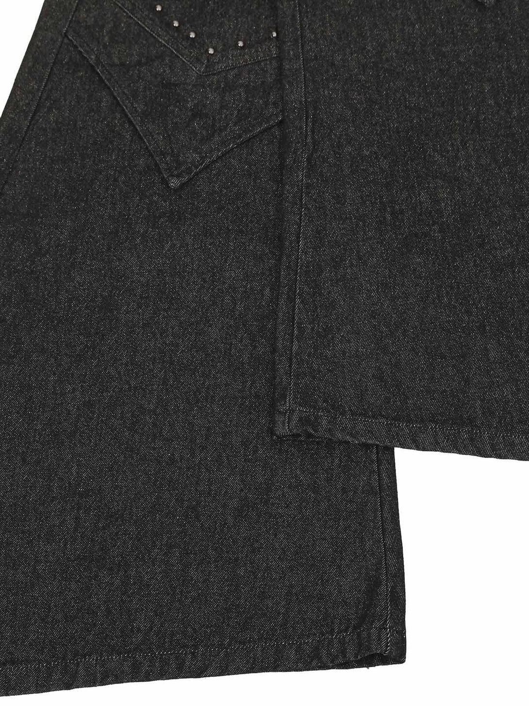 Focusing on the intricate pocket design and rivet details of TALISHKO's deconstructed jeans.