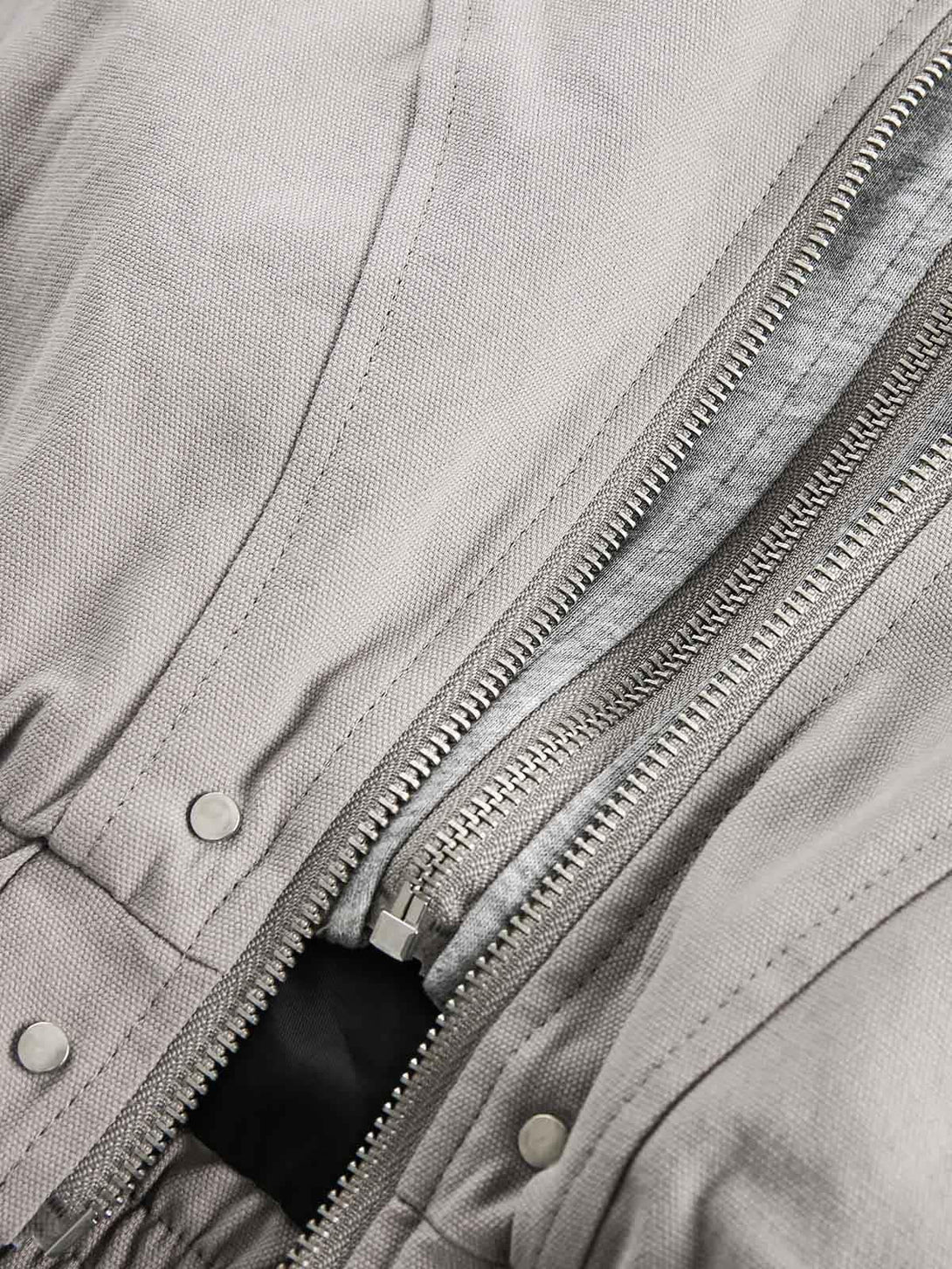 Intricate look at the TALISHKO jacket's zipper and texture, highlighting its unique design.