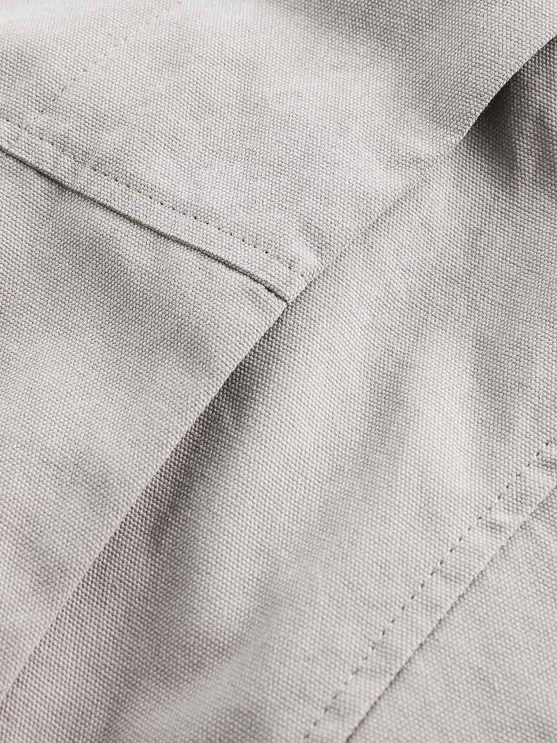 Detailed fabric and stitching of TALISHKO's hooded jacket, showcasing its unique texture.