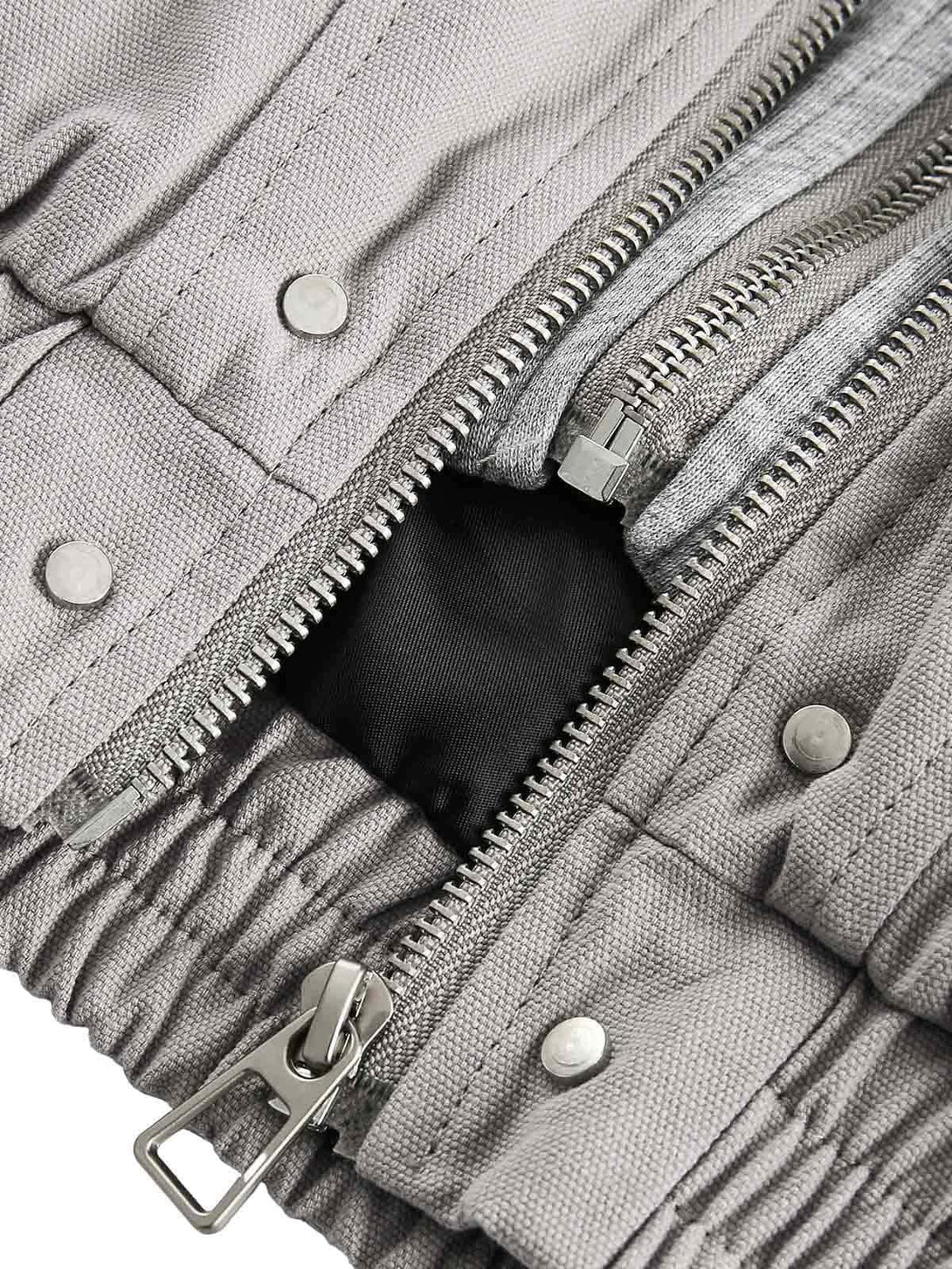 Zoomed-in detail of TALISHKO's jacket zipper and fabric, showcasing a unique deconstructed design.