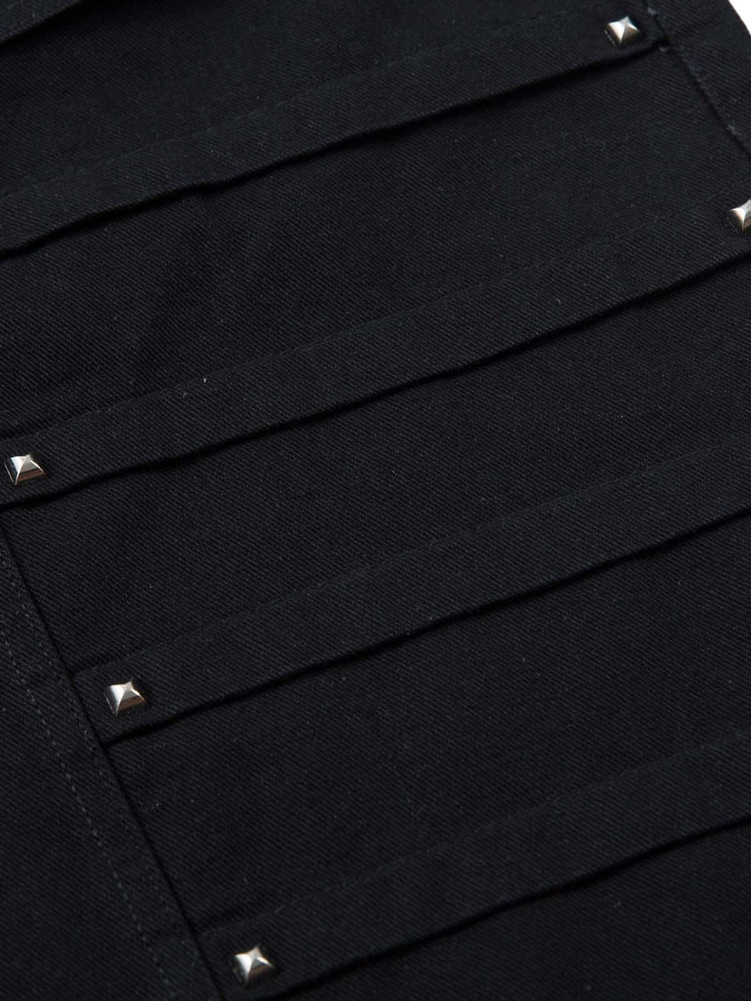 Intricate look at TALISHKO's black deconstructed cargo jeans, showcasing rivet detailing.