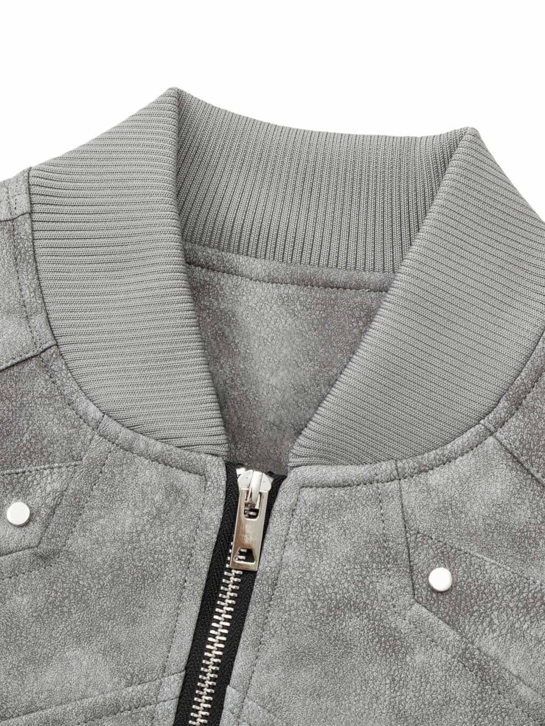 Detailed view of TALISHKO's deconstructed bomber jacket collar, highlighting textured fabric.