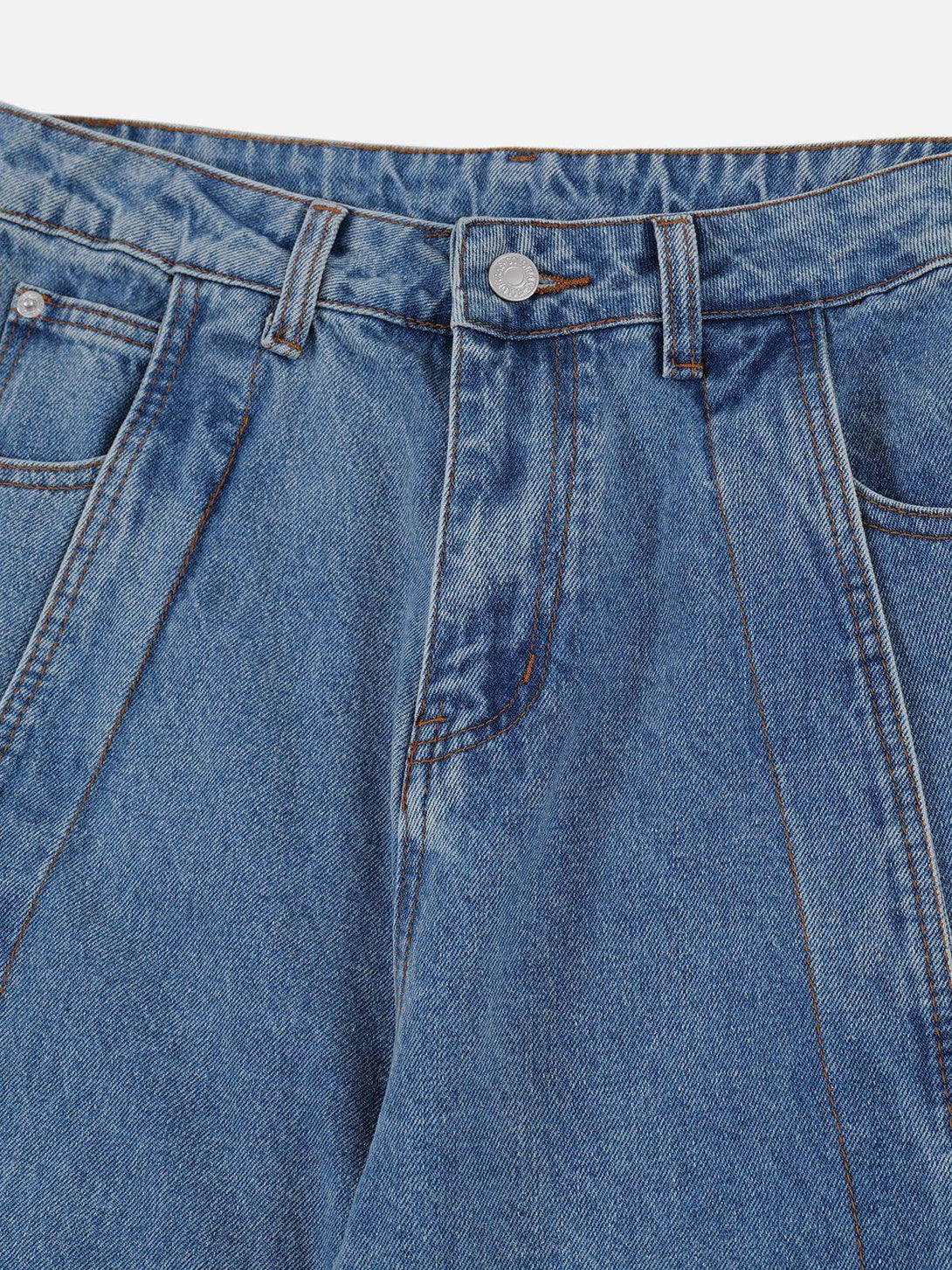 Detailed fabric and stitching of TALISHKO loose jeans, highlighting their unique deconstruction design.