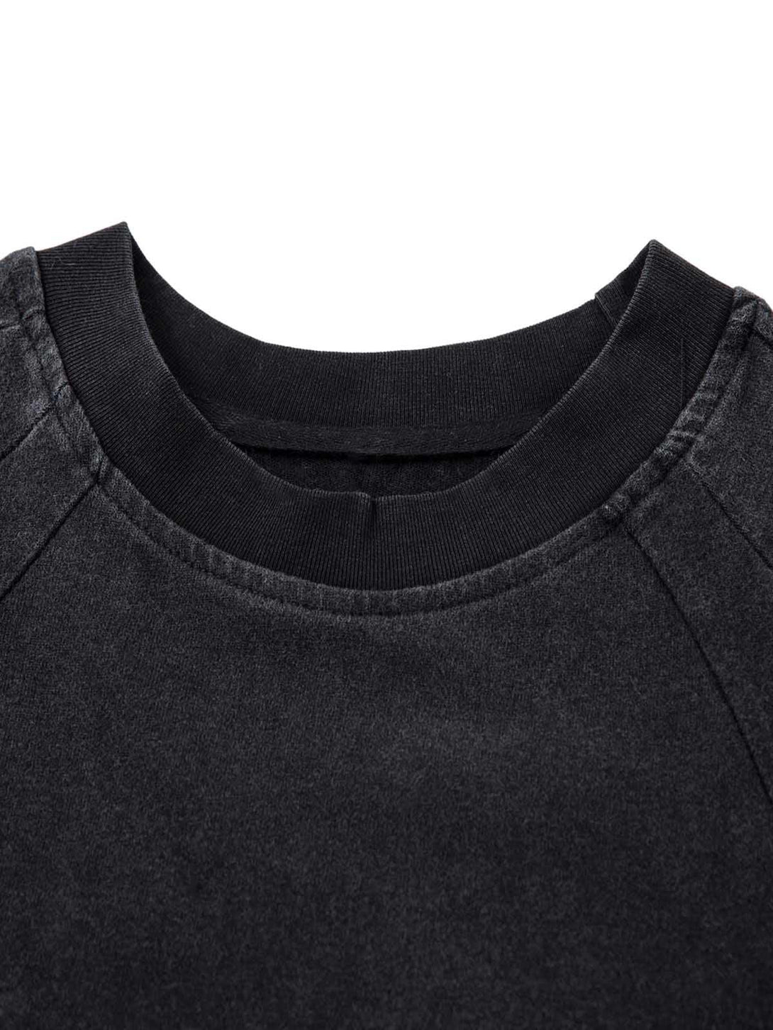Neckline detail of TALISHKO's deconstructed split T-shirt, highlighting the unique texture.