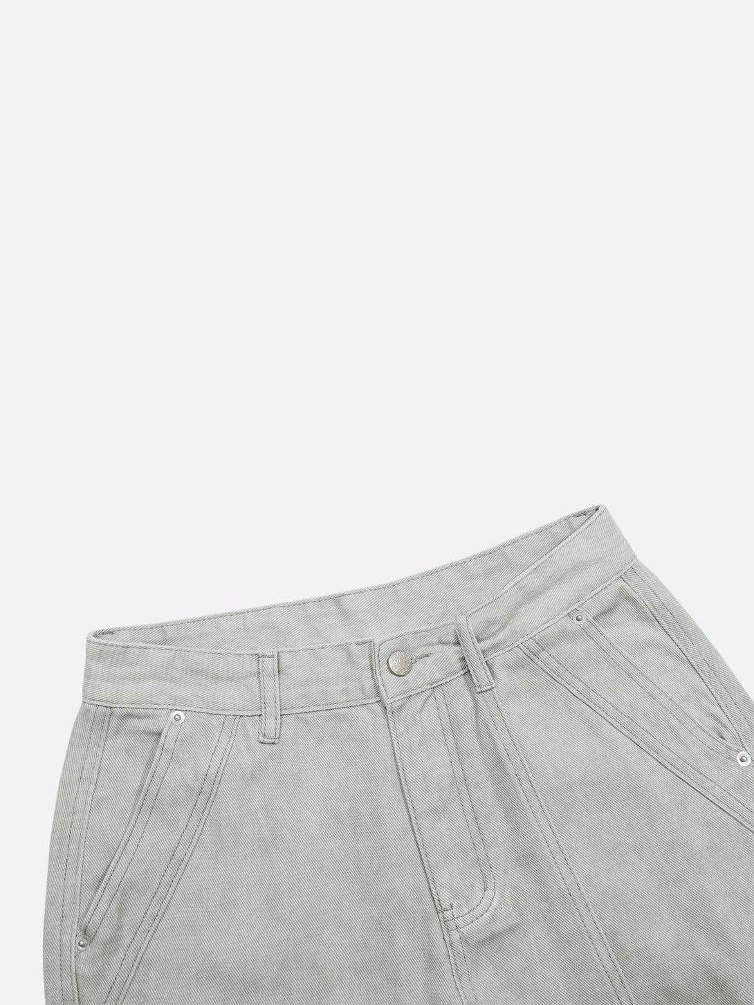 Focusing on the waist and pocket design of TALISHKO deconstructive patchwork jeans.