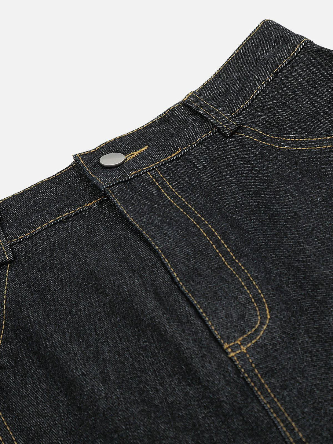 Detailed look at TALISHKO jorts, showcasing intricate stitching and classic button design.