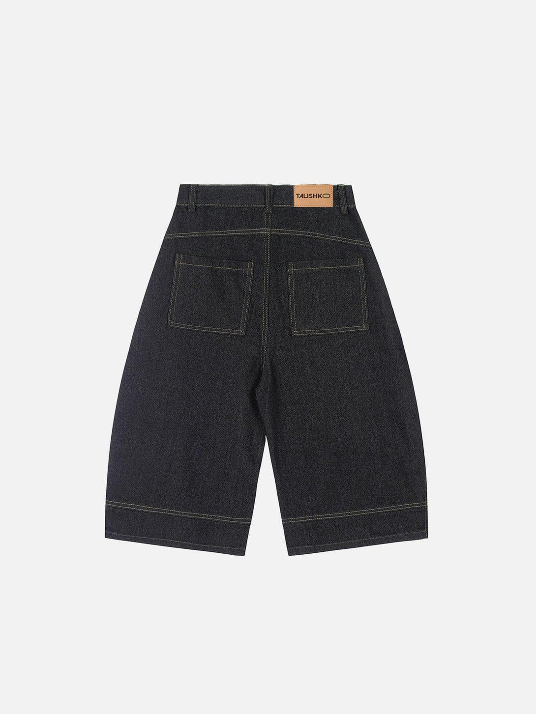 Back view of TALISHKO longline jorts, featuring a deconstructive washed design and stylish pockets.